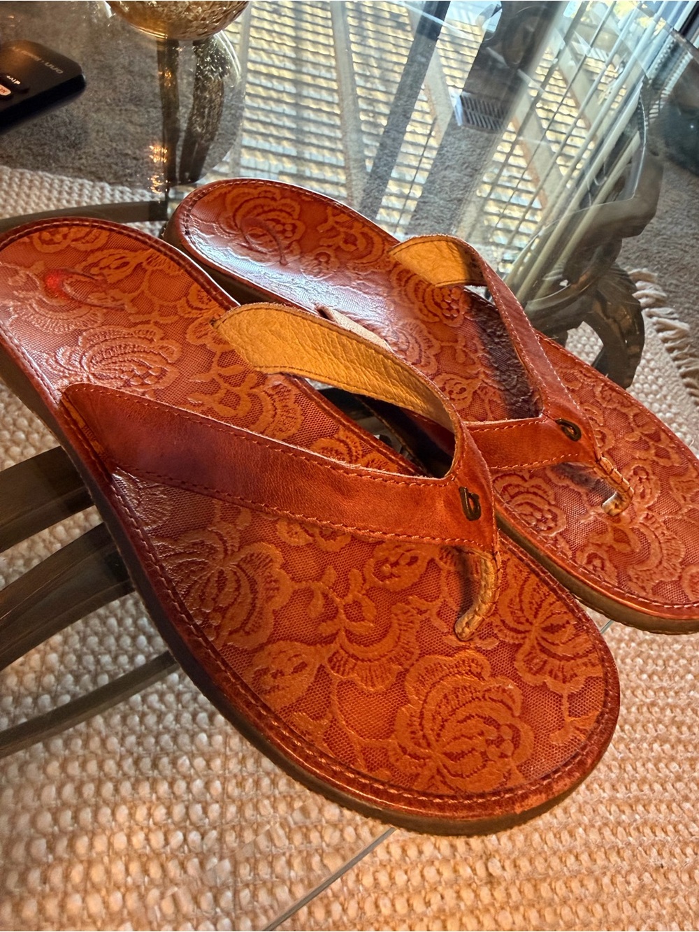OluKai Women's Floral-Embossed Brown Leather Flip Flops